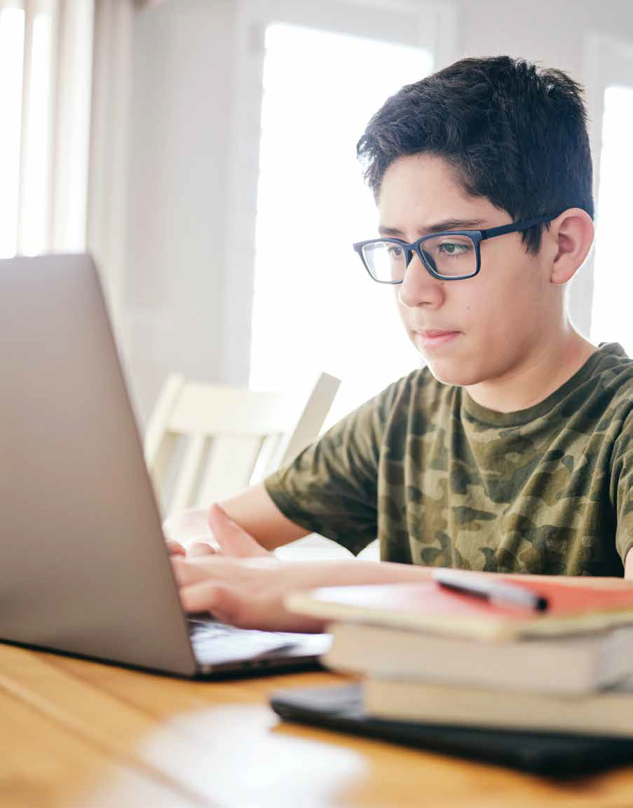 Student typing on computer