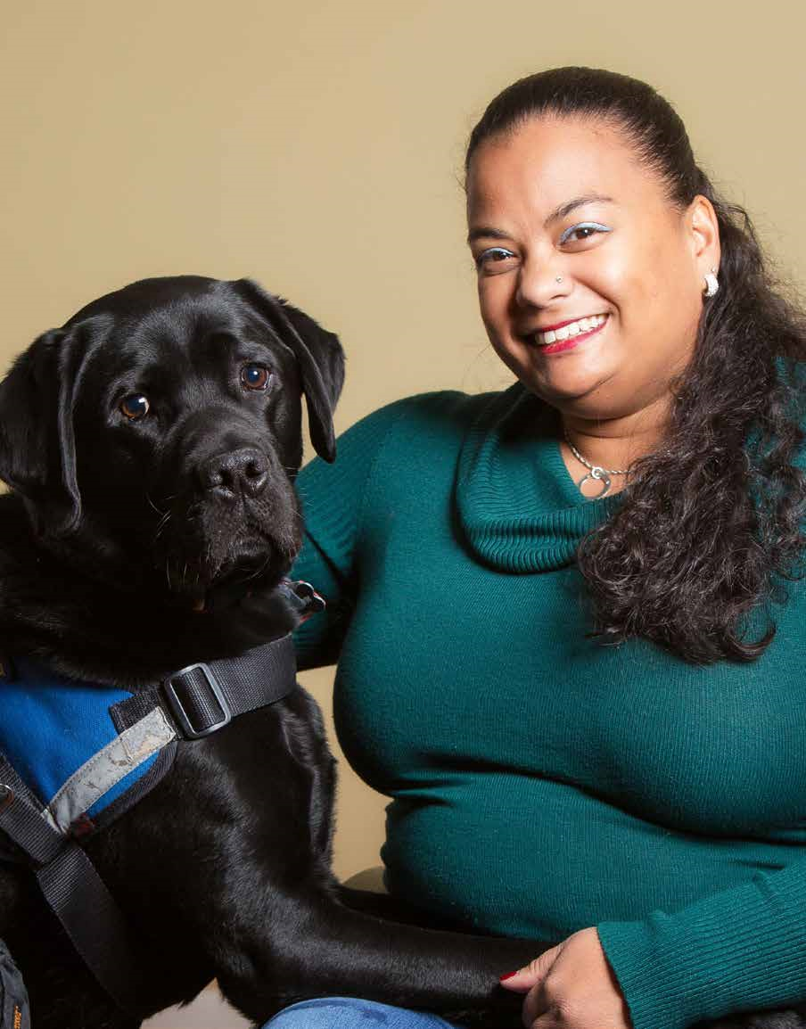 Dr. Anjali Forber-Pratt with a service dog