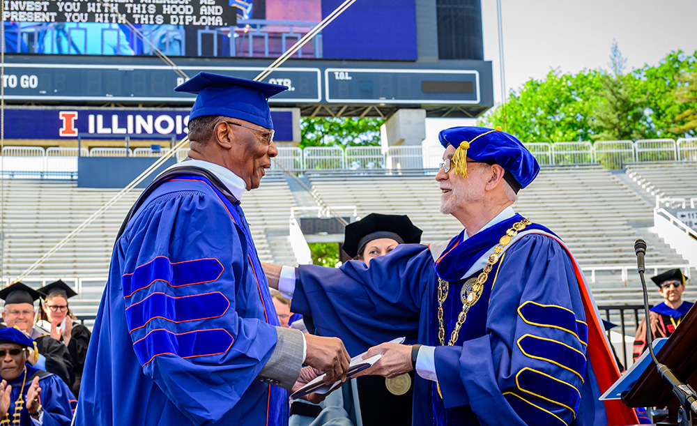 James Anderson receives his degree from President Tim Kileen at the University of Illinois